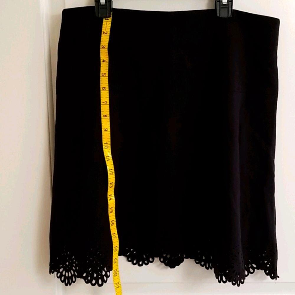 Size 6, Black A line skirt with cute floral cut hem.